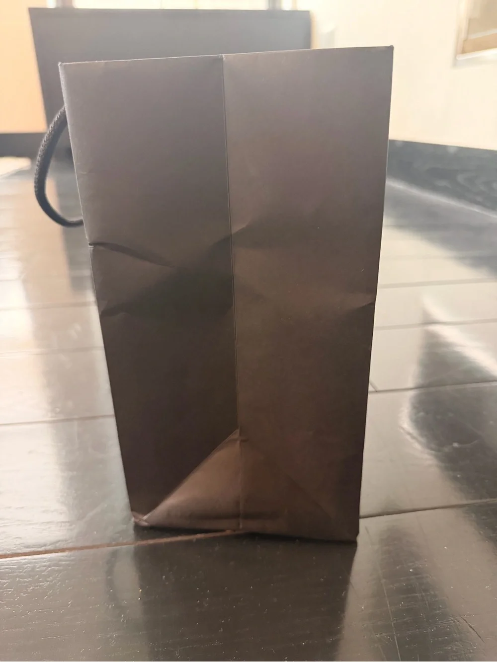 CHANEL Black bag (12” x 9”) with sticker flower accent